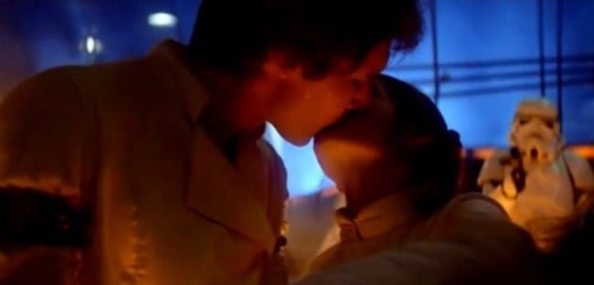 Still from Empire Strikes Back. Han Solo is kissing Princess Leia.