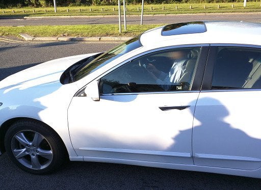 Man playing with phone while driving.