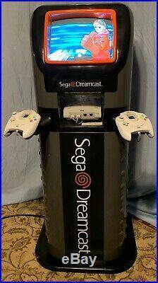 Tall retail unit with a CRT TV on top - it has Sega Dreamcast branding.