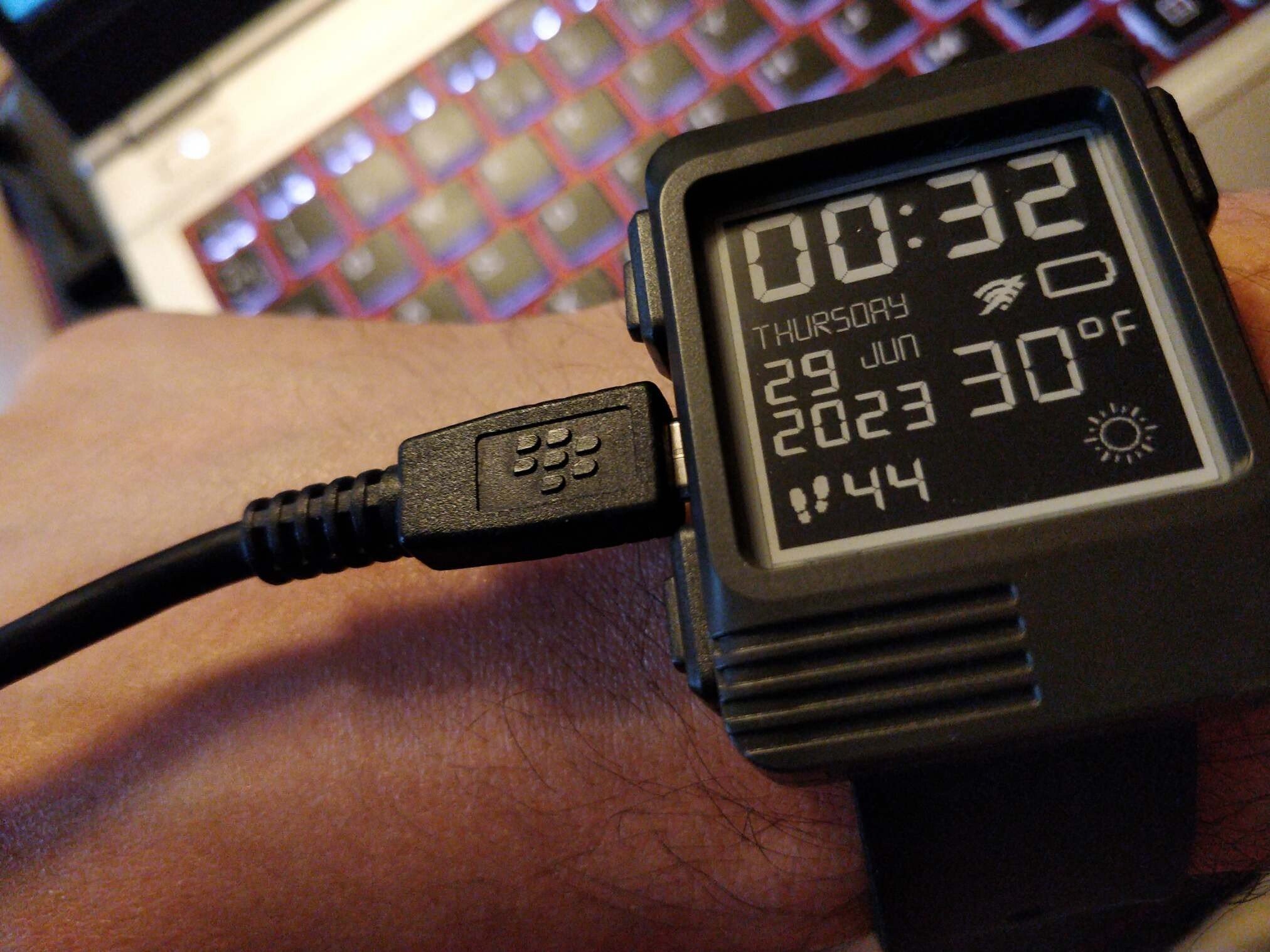 Watch with a big USB cable plugged in.